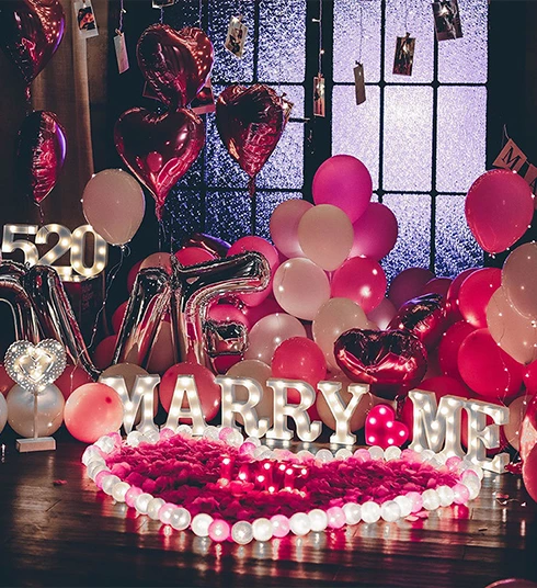 Romantic couple proposal decoration with balloons at private theatre in Delhi