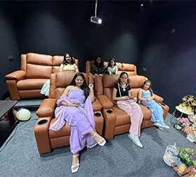 Family enjoying private movie theatre in Delhi at MeetFlix