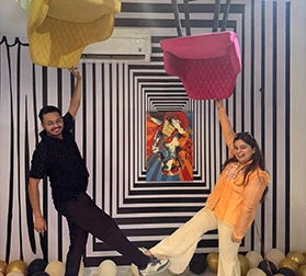 Couple enjoying creative photoshoot at MeetFlix private theatre Delhi